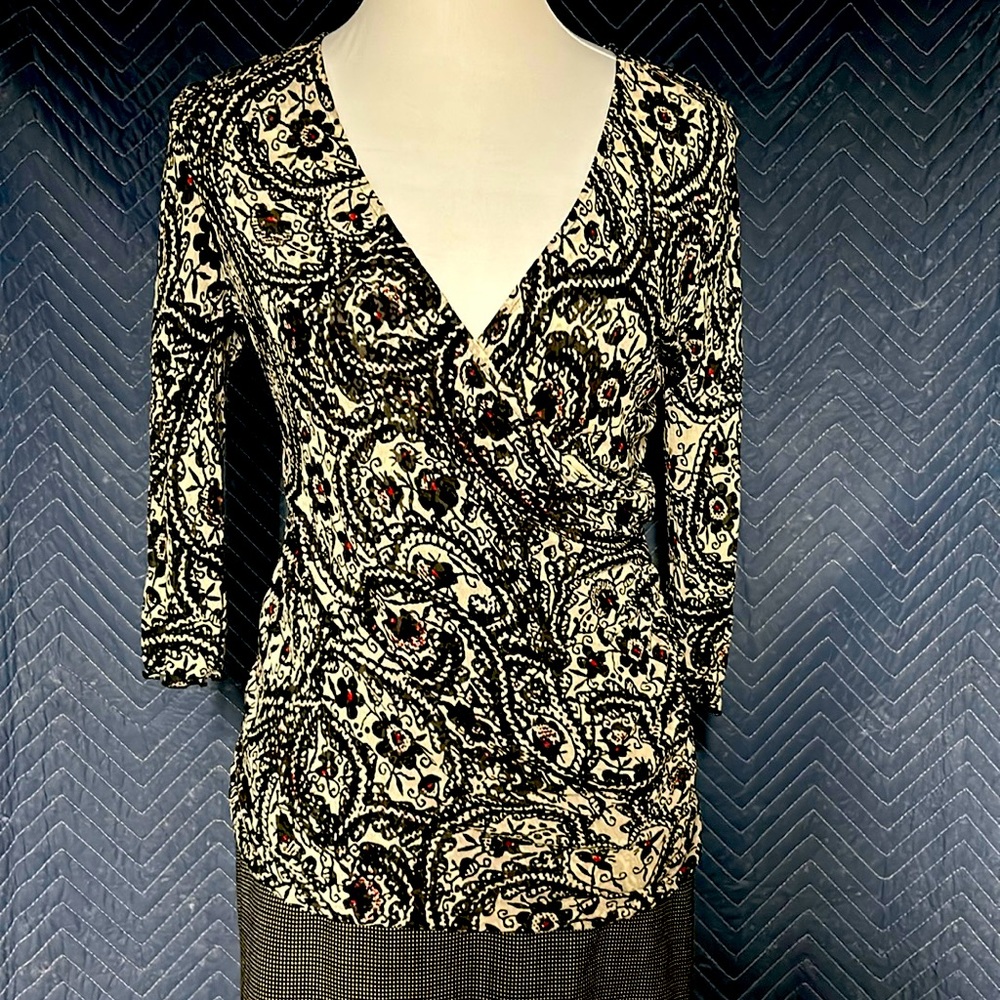 DVF faux wrap top in black/ white swirl pattern. Semi sheer silk jersey . size L